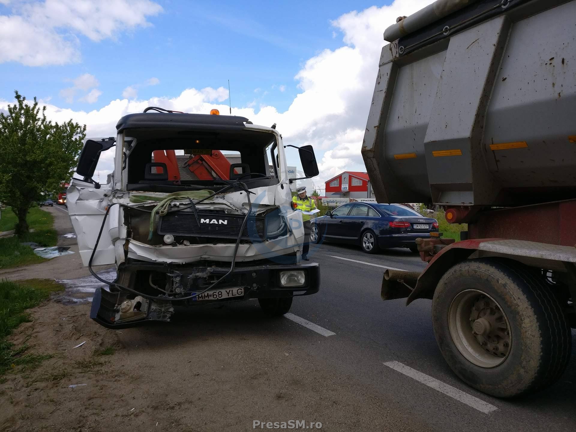 FOTO&VIDEO. Impact între un TIR și un camion în municipiul Satu Mare. Un copil, la Urgențe