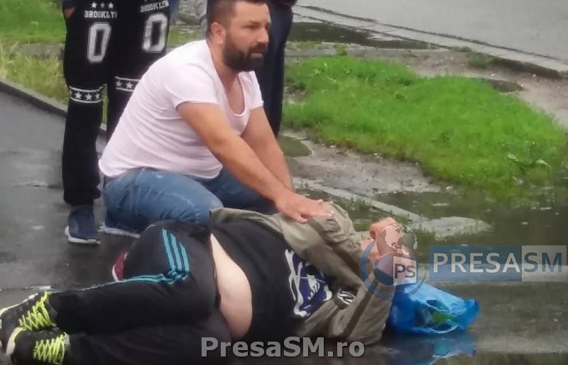 FOTOGALERIE. Imagini dramatice în Satu Mare. Bărbat căzut pe stradă