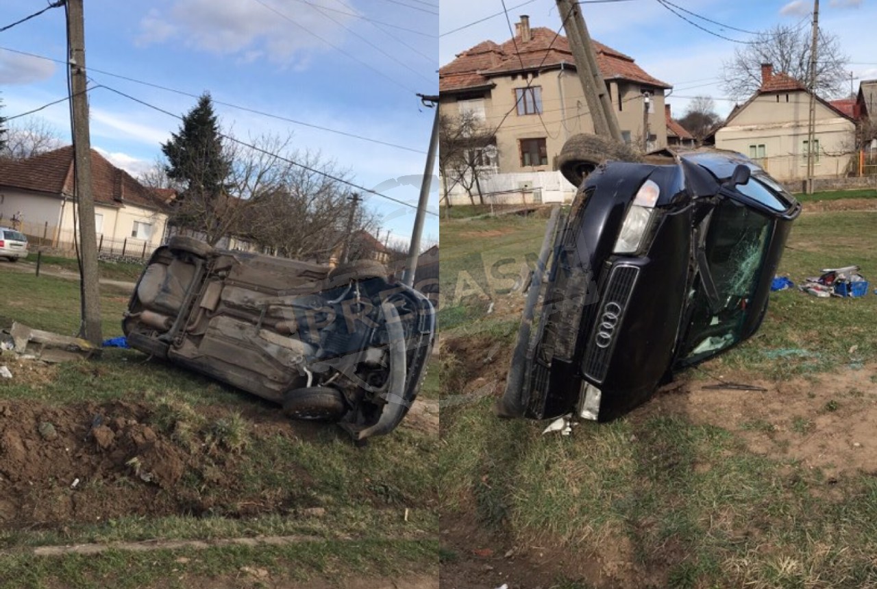 FOTO. Fără permis, mort de beat, a ”furat” o mașină, a spulberat un stâlp și s-a răsturnat în șanț