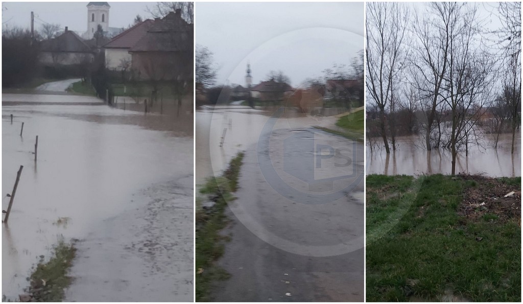 FOTO/VIDEO. Inundații în Sătmărel. Șosea acoperită de apă, circulație blocată
