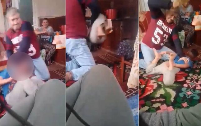 VIDEO. Scene de o cruzime greu de imaginat. Un tată își apucă copilul de gât și îl bate. Mama asistă amuzată