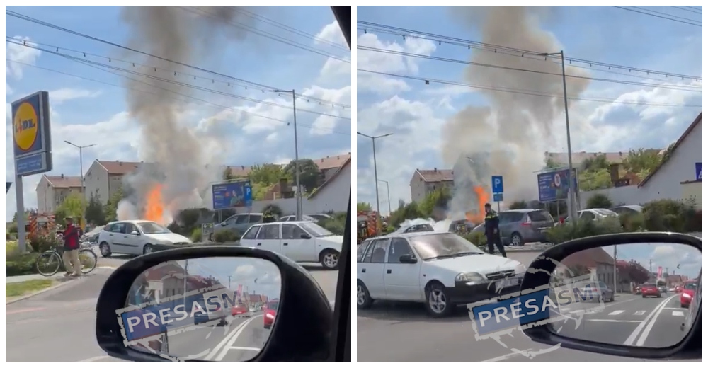 FOTO/VIDEO. Mașină făcută scrum în parcarea Lidl! Incendiul s-a întins la anexele din jur